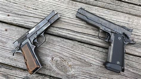 1911 and Hi-Power pistols side by side