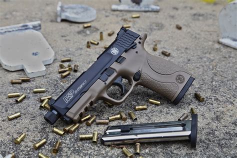 A.22 pistol owner cleaning their firearm