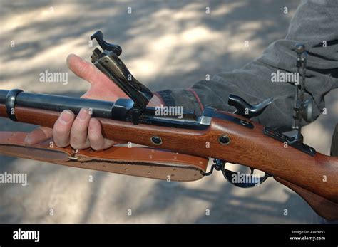 Competitive shooter firing a.50 cal at a match