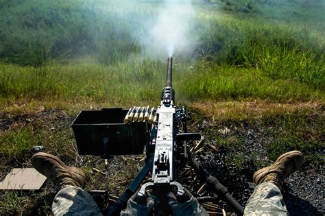 Soldier firing a.50 cal at a range