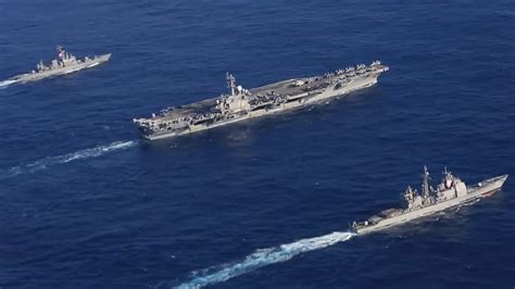 USS Abraham Lincoln (CVN-72) and its accompanying ships underway in the Pacific Ocean