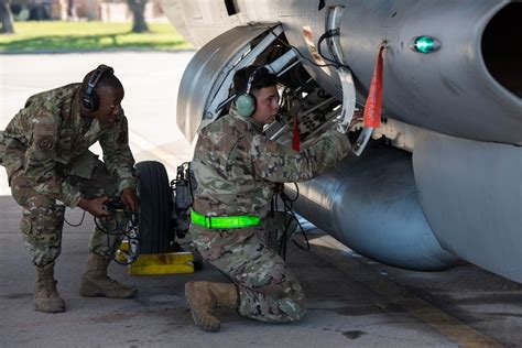 Air Force Crew Chief addressing issues during flight