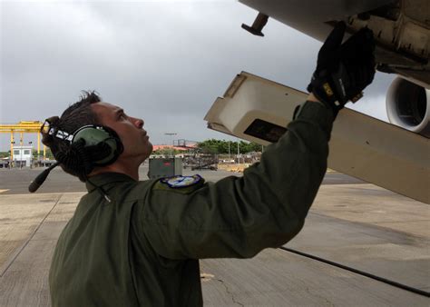 Air Force Crew Chief ensuring aircraft airworthiness