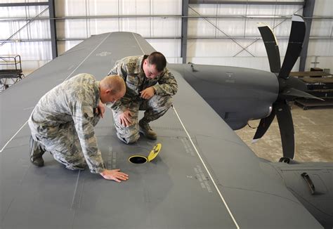 Air Force Crew Chief ensuring aircraft configuration