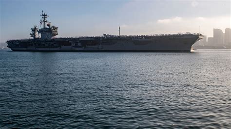 Various aircraft carrier maintenance operations, showcasing different methods.