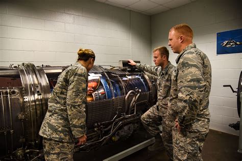 Aircraft maintenance officer working on a jet engine