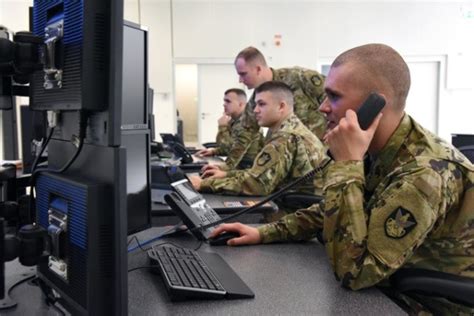 Intelligence Analyst working on computer