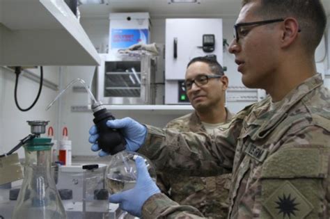 Medical Laboratory Specialist working on microscope