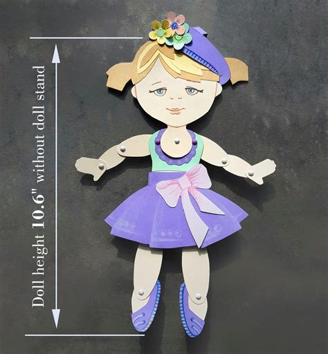 A beautifully crafted articulated paper doll