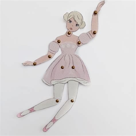 A beautifully crafted articulated paper doll with intricate details