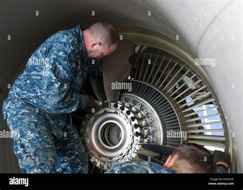 Aviation Machinist Mate conducting an inspection