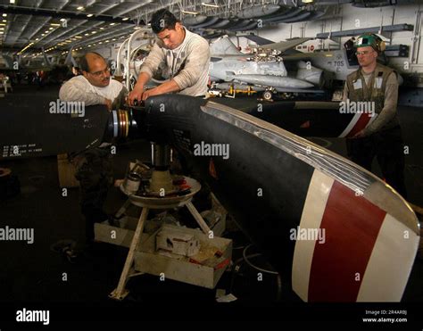 Aviation Machinist Mate inspecting a propeller