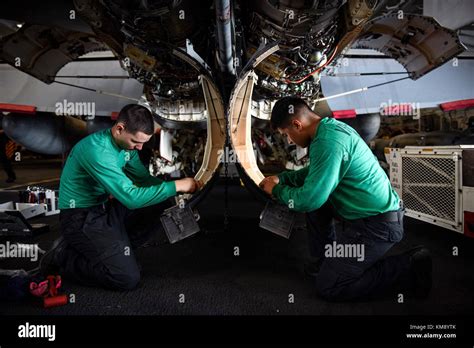 Aviation Machinist Mate working on an aircraft