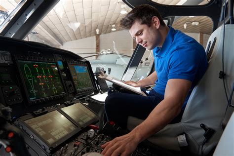 Avionics Technician inspecting aircraft electronics