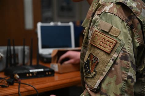 California Air National Guard cybersecurity specialist working on a computer