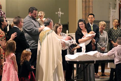 Christening guests receiving blessings