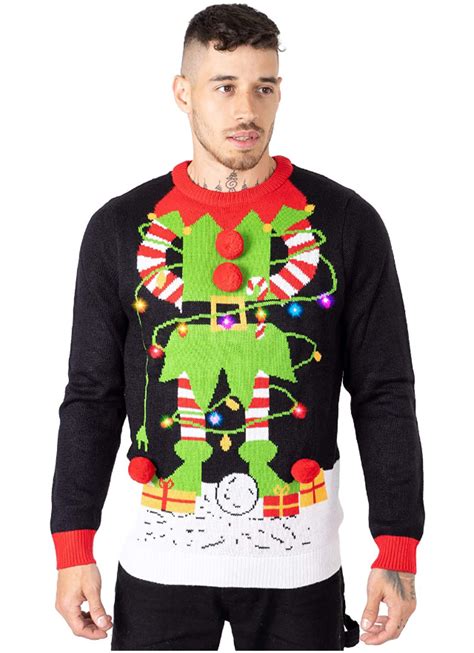 A person upcycling an old jumper into a Christmas jumper