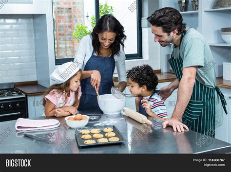 A couple cooking together in the kitchen