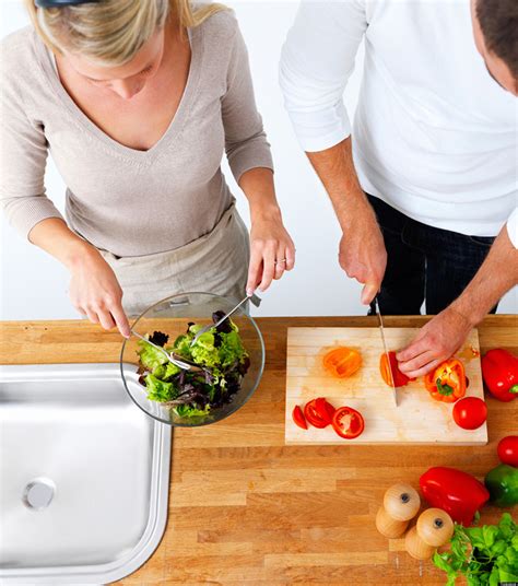 A couple following cooking together tips