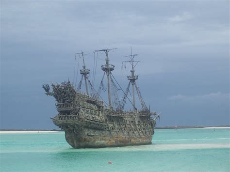 A painting of a pirate ship sailing the high seas