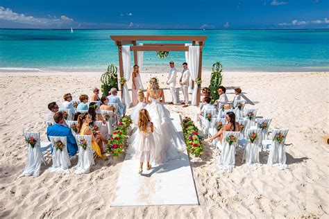 Couple on a beach, planning their destination wedding