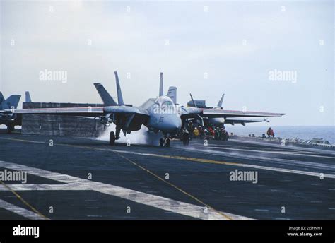 F-14 taking off from an aircraft carrier