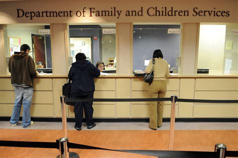 A person searching for the Food Stamp Office on a computer