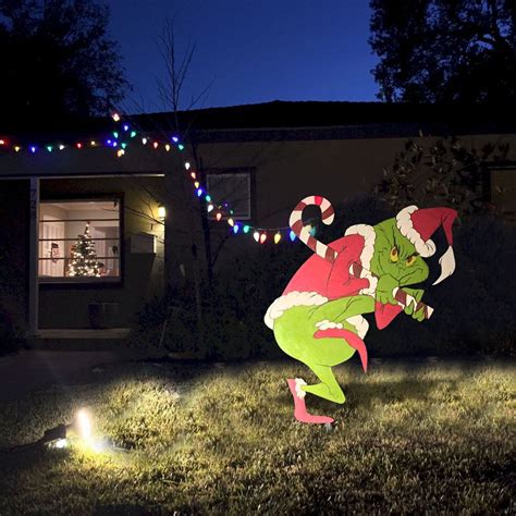 Grinch stealing Christmas lights from a city