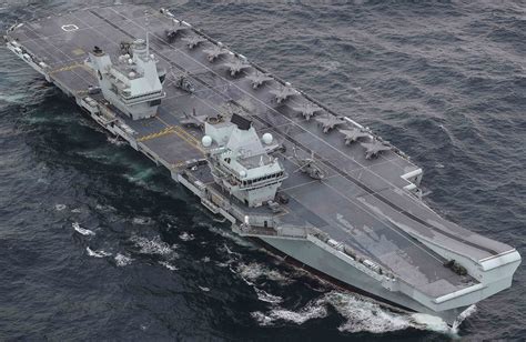 HMS Prince of Wales leaving Rosyth Dockyard for the first time