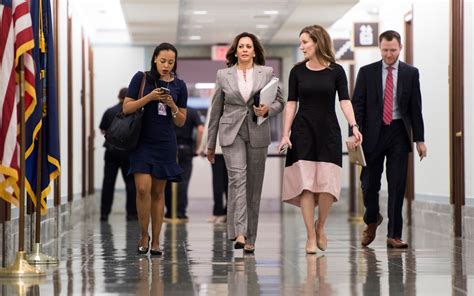 Kamala Harris Listening to Staff Members