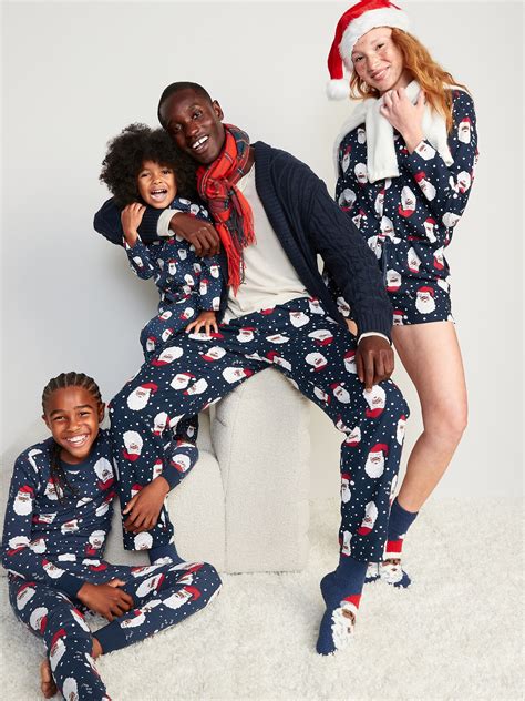 Family enjoying holiday activities in their Old Navy Christmas Pajamas