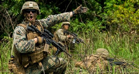 A Marine Infantry Officer leading a team of Marines