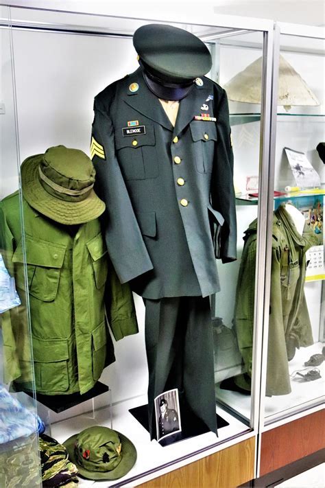 A Marine's uniform components, including the coat, trousers, dress shirt, and cover