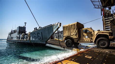 Marines loading supplies onto a truck