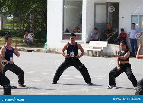 A person in a martial arts uniform, representing a martial artist pugilist