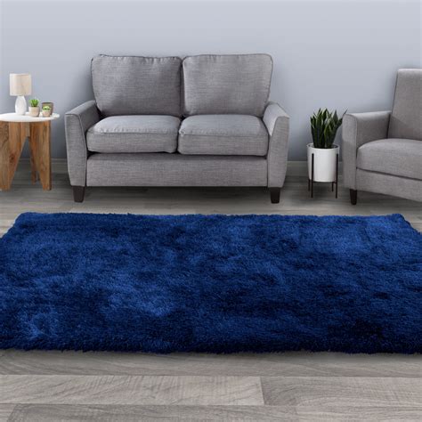 Navy Blue Couch with a Plush Area Rug