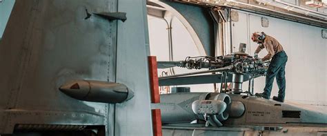 Navy Engineer performing aircraft maintenance