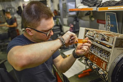 Navy Engineer working on aviation systems