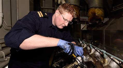 Navy Engineer working on mechanical systems