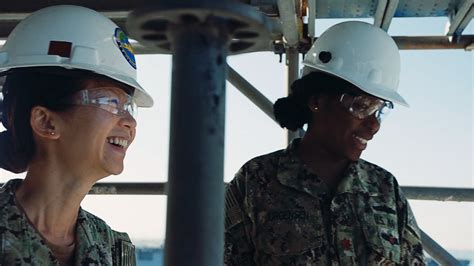 Navy engineers working on a ship's engine