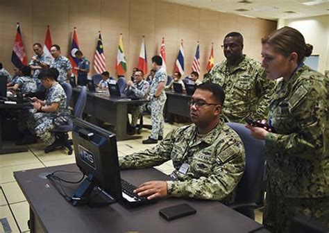 Navy Reserve intelligence personnel at work