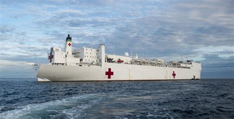 HM providing medical care on a Navy ship