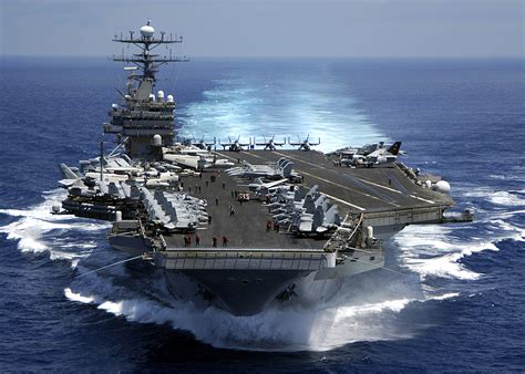 The USS Nimitz (CVN-68) undergoing a major modernization program, highlighting its upgraded propulsion system