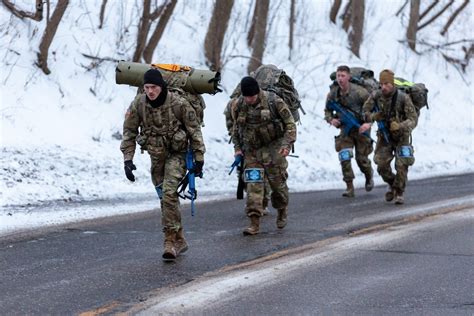 Soldiers maintaining equipment in the Arctic