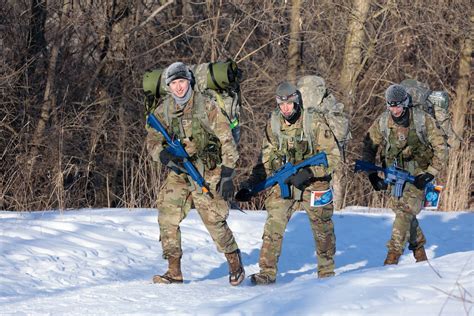 Soldiers working together in the Arctic environment