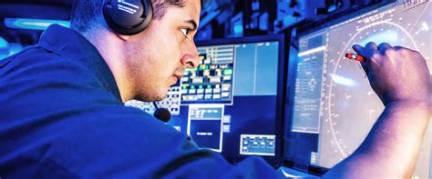 Operations Specialist monitoring radar screens