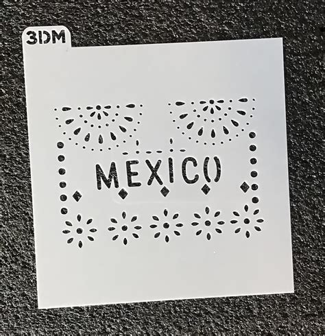 A stencil featuring a Day of the Dead skull design