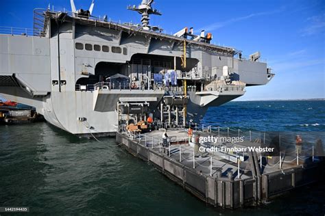 Pontoon-based repairs being carried out on an aircraft carrier.