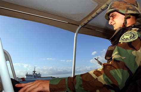 Port Security Specialist inspecting a cargo ship