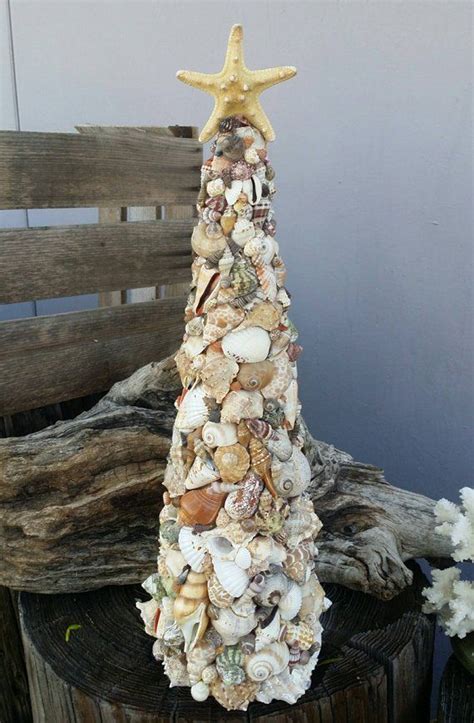 A Christmas tree decorated with seashells and driftwood